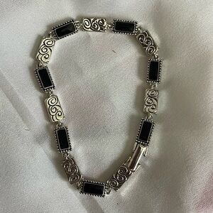 Silver tone and black bracelet